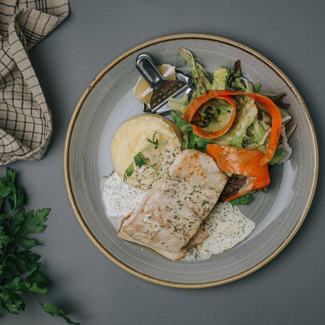 Fried perch fillet with butter-dill sauce