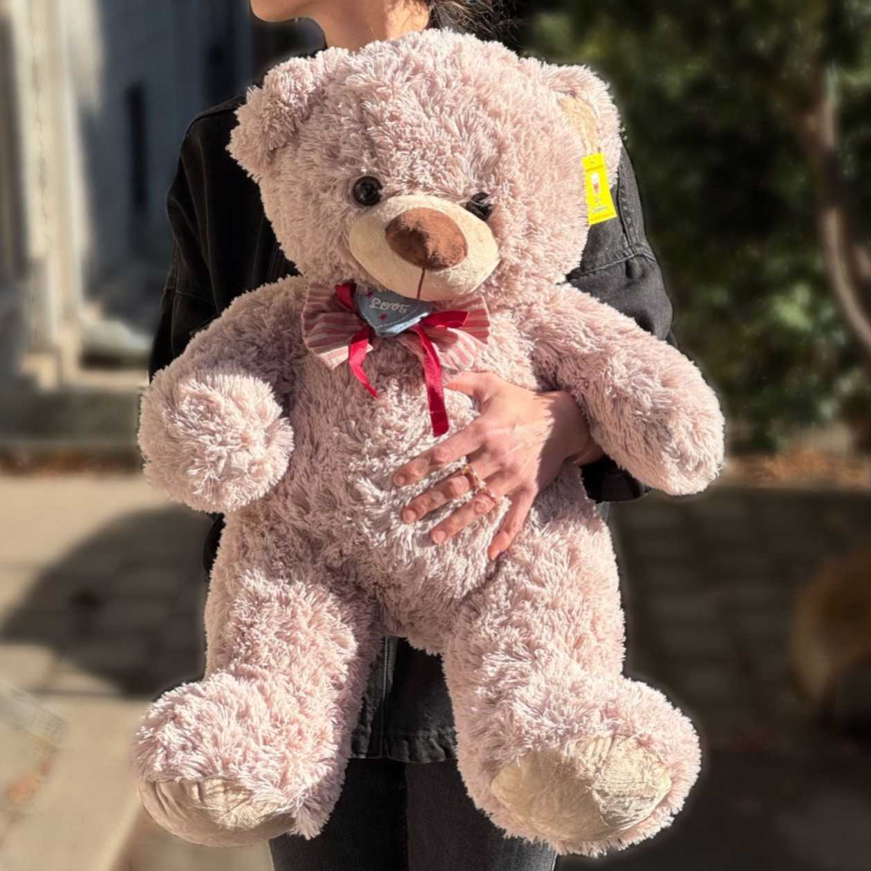 Soft toy teddy bear with tie bow "Love"