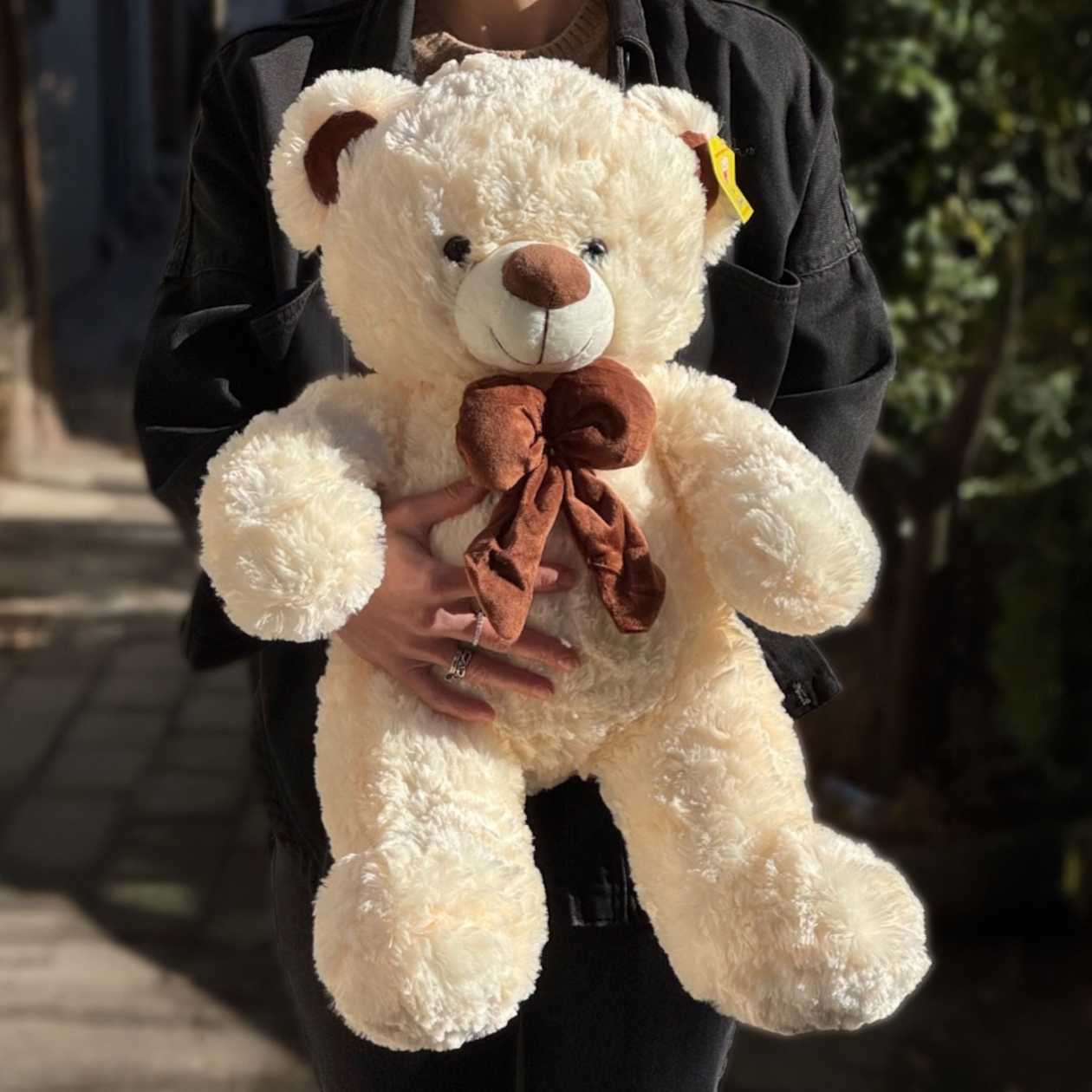 Soft toy teddy bear white with brown tie bow