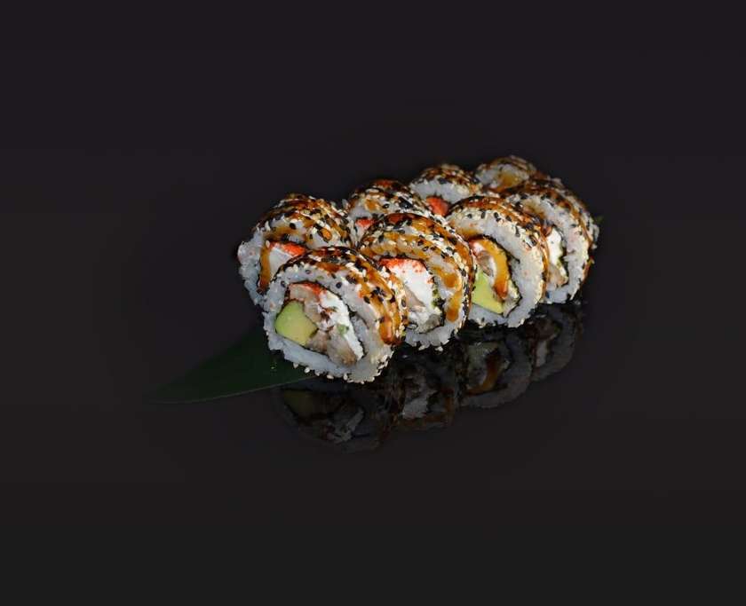 Philadelphia roll with eel in sesame seeds