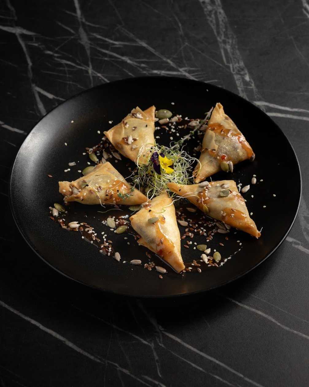 Pork samosa with curry and sweet chilli sauce