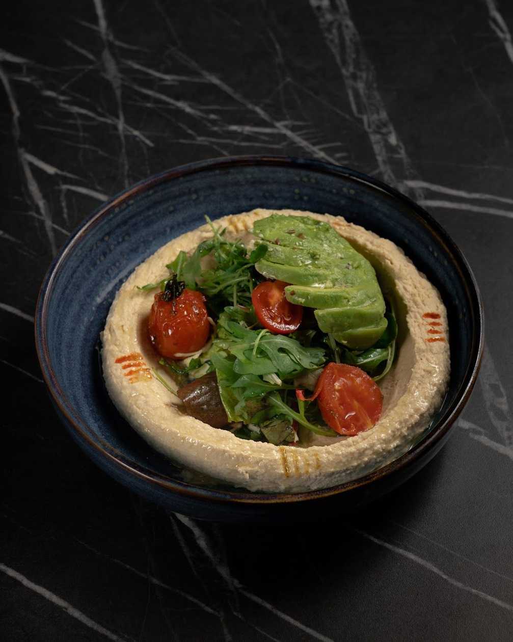 Hummus with tabbouleh and avocado