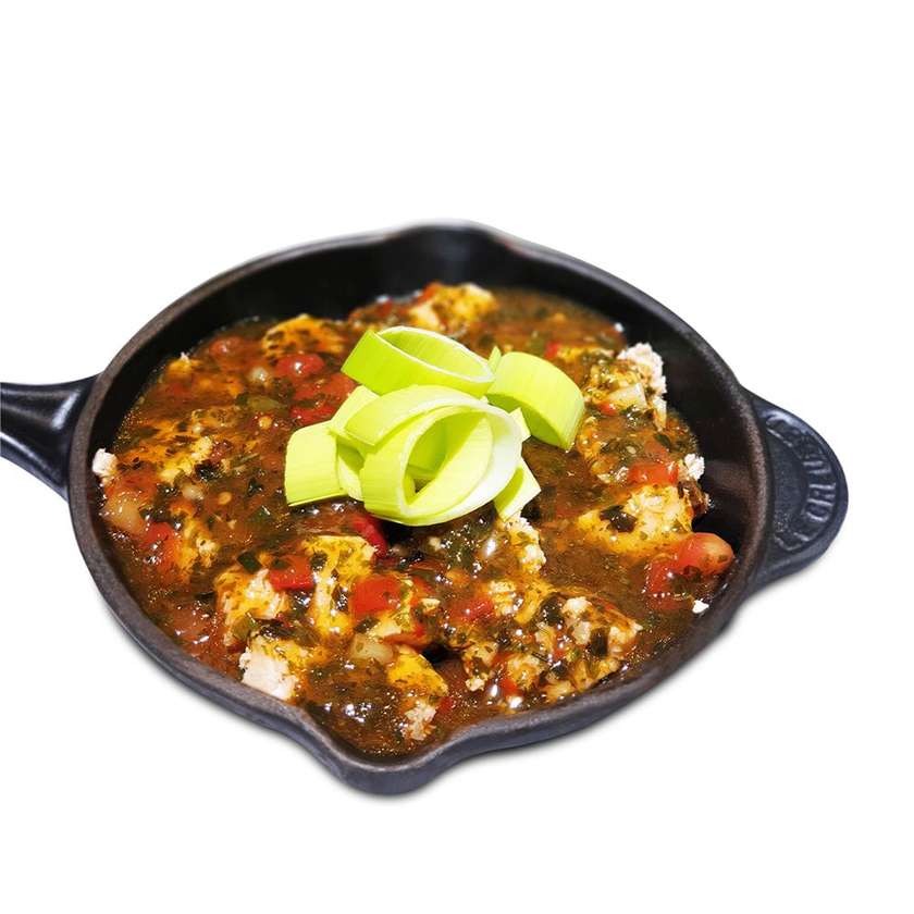 Pan with salmon in spicy sauce