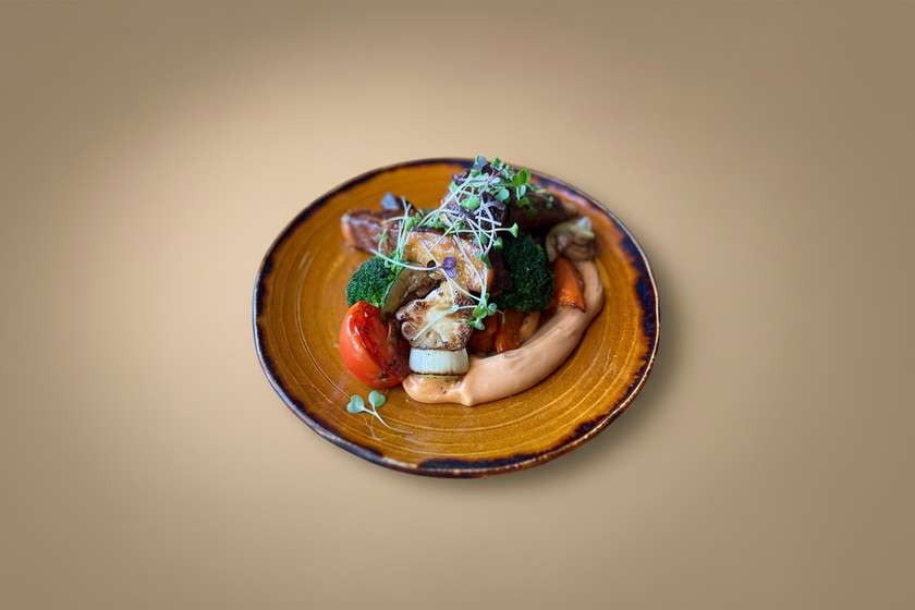 Spicy grilled ribs with warm veggie salad