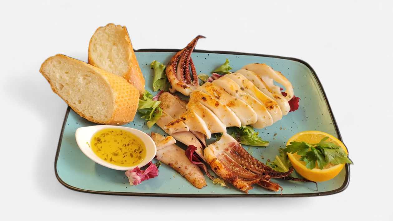 Grilled Mediterranean Calamari, served with grilled vegetables and lemon-oregano sauce 600g
