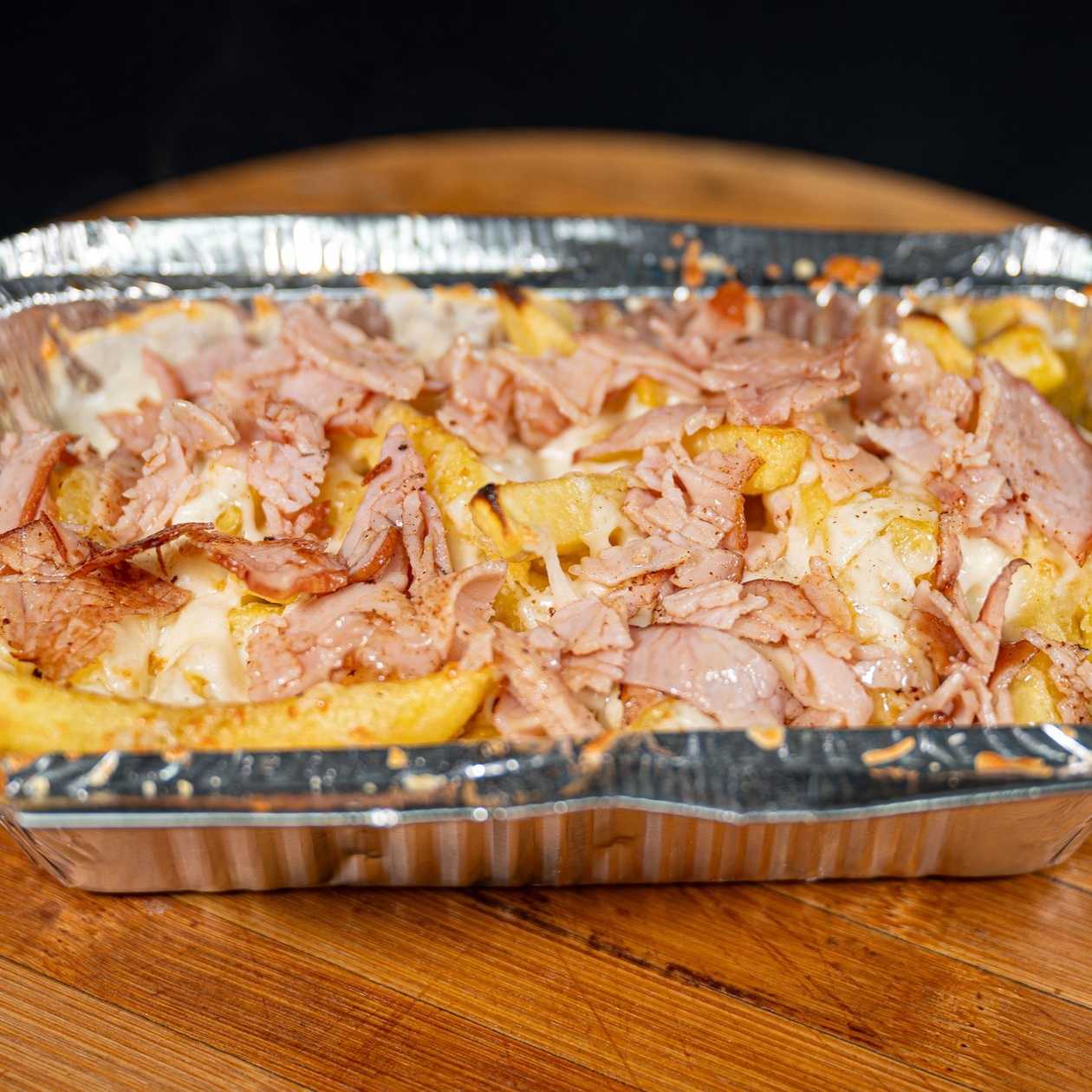 Baked Potatoes with Garlic, Bacon, and Mozzarella