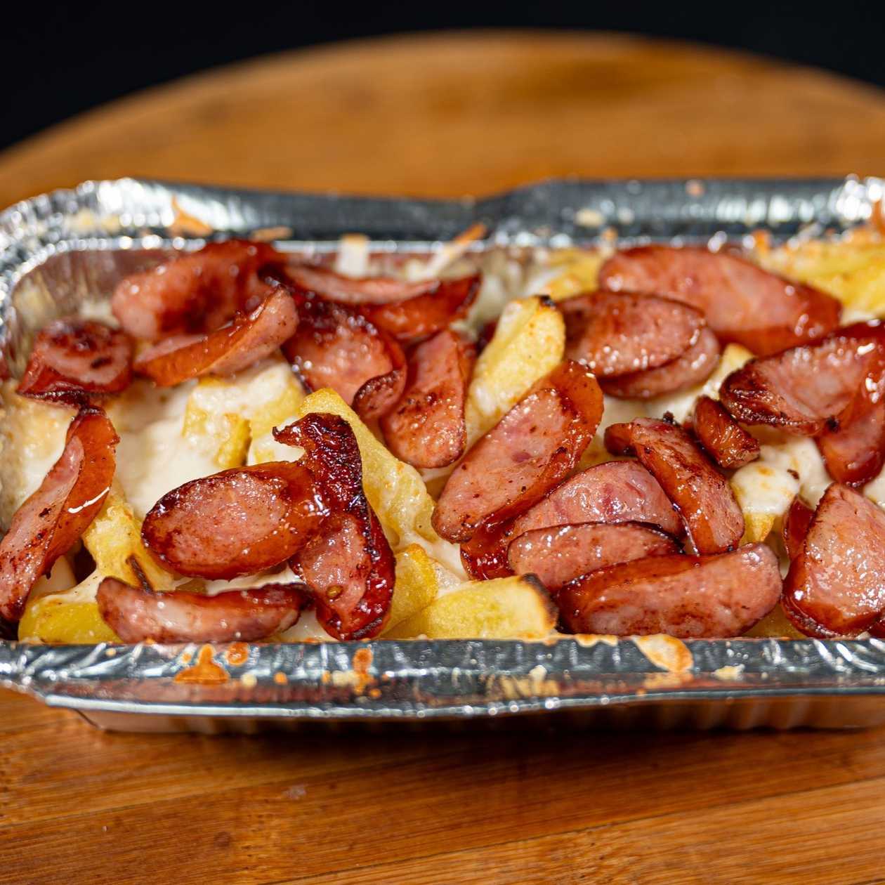 Baked Potatoes with Garlic, Sausages and Mozzarella