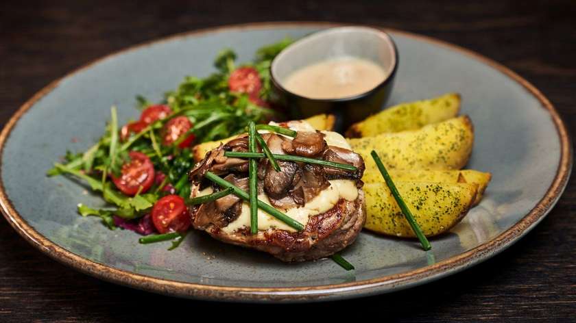 Pork tenderloin with mushrooms and cheese