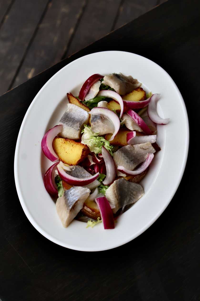 Herring with baked potatoes and onions
