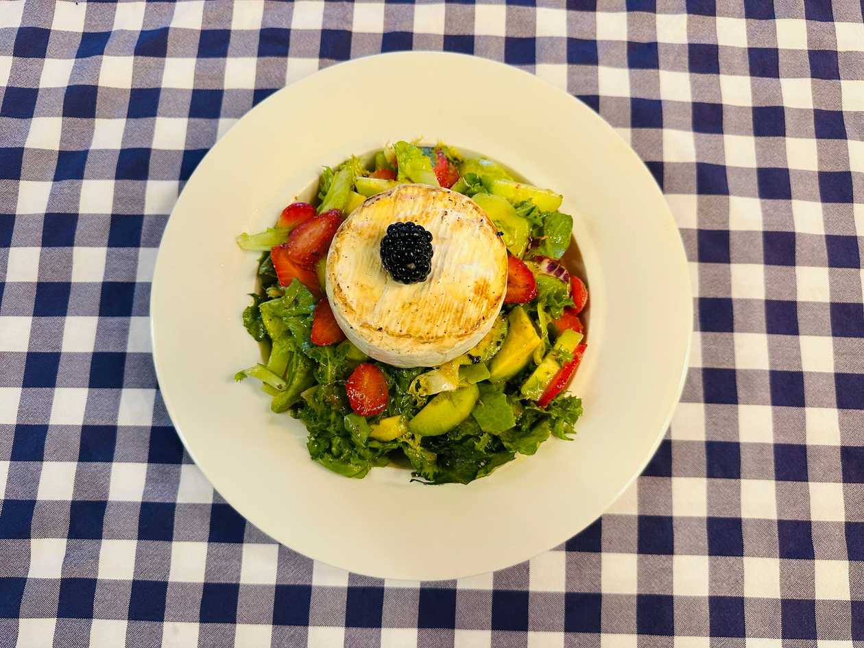 Grilled Camembert with salad, mint dressing, and toasted bread