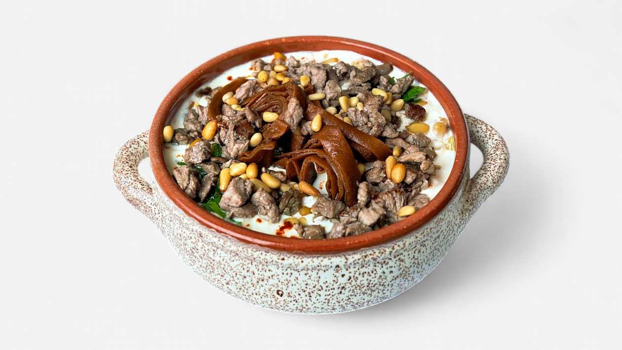 Fatte with hummus, beef and pine buds