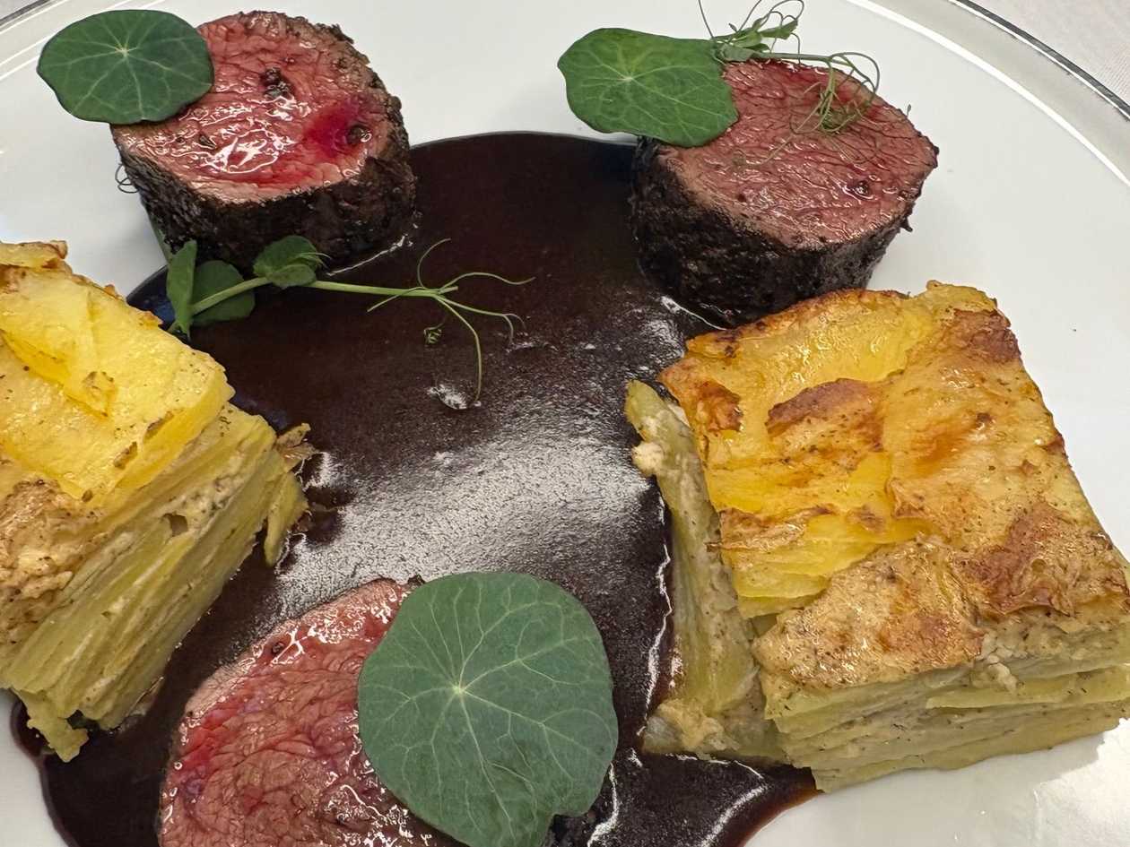 Pink Grilled Deer Loin with Juniper Berry Demiglace and Potato Gratin