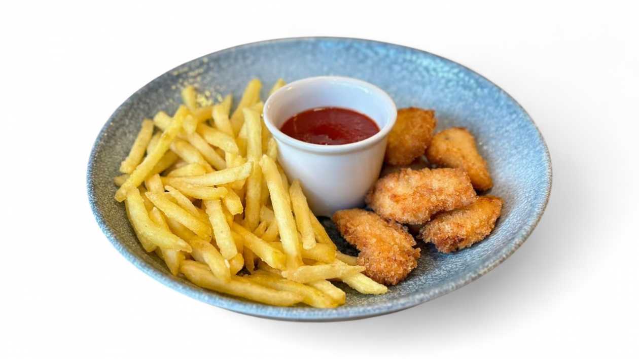 Chicken nuggets with fries and tomato sauce