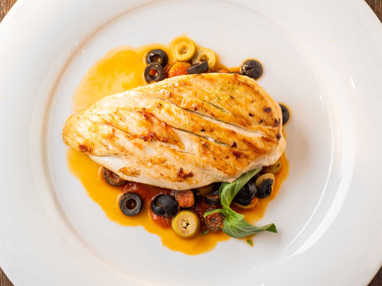 Chicken breasts with basil-olive sauce