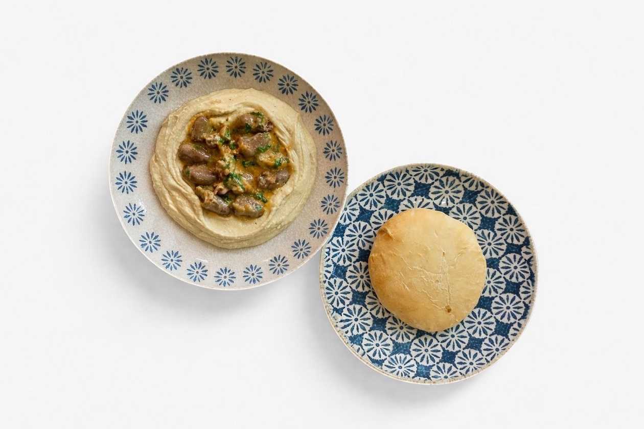 Hummus with Chicken Hearts in Creamy Sauce and Pita Bread