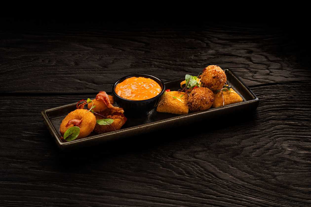 Deep-fried ham and cheese rings, cheddar squares, and macaroni and cheese balls