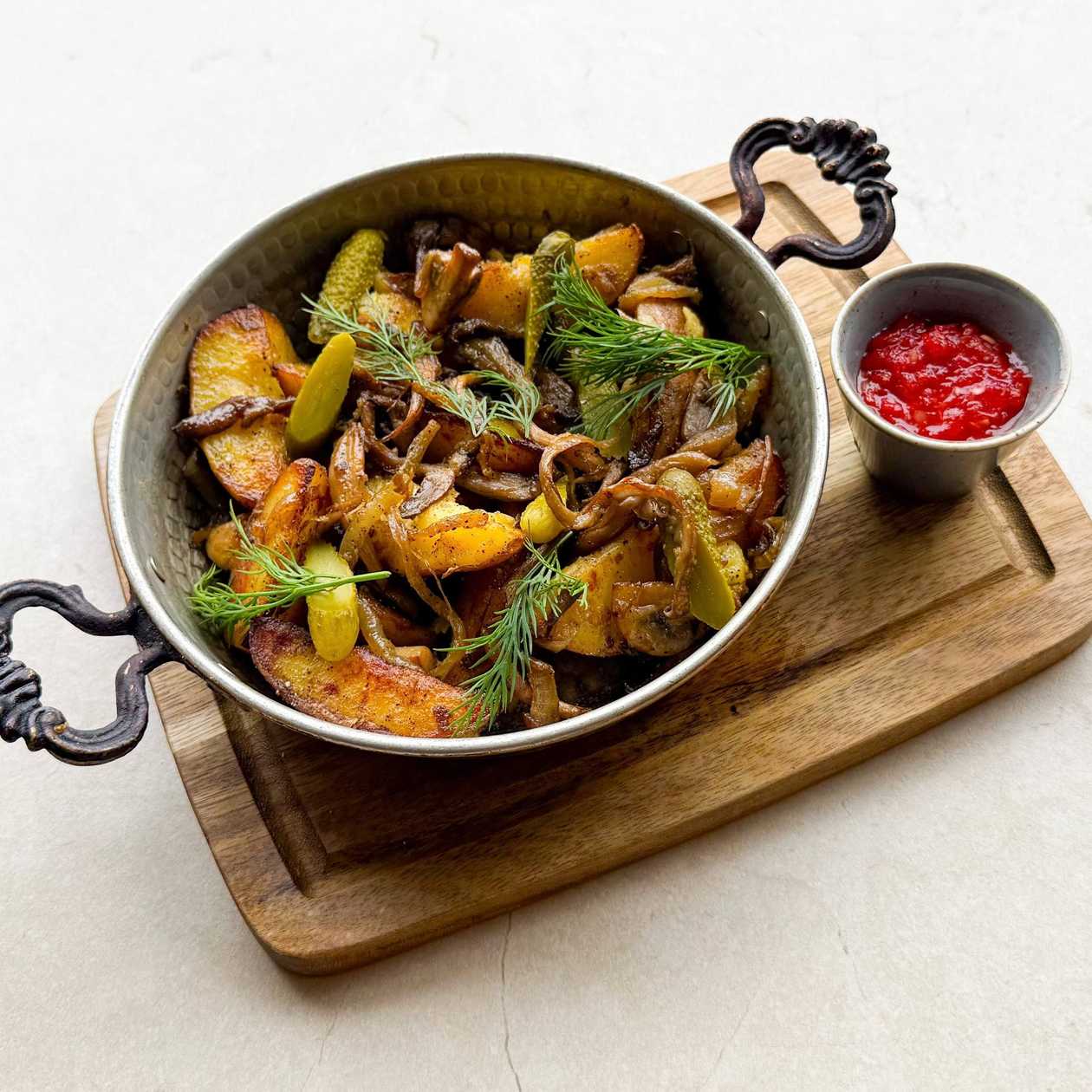 Country-style potatoes with mushrooms and adjika