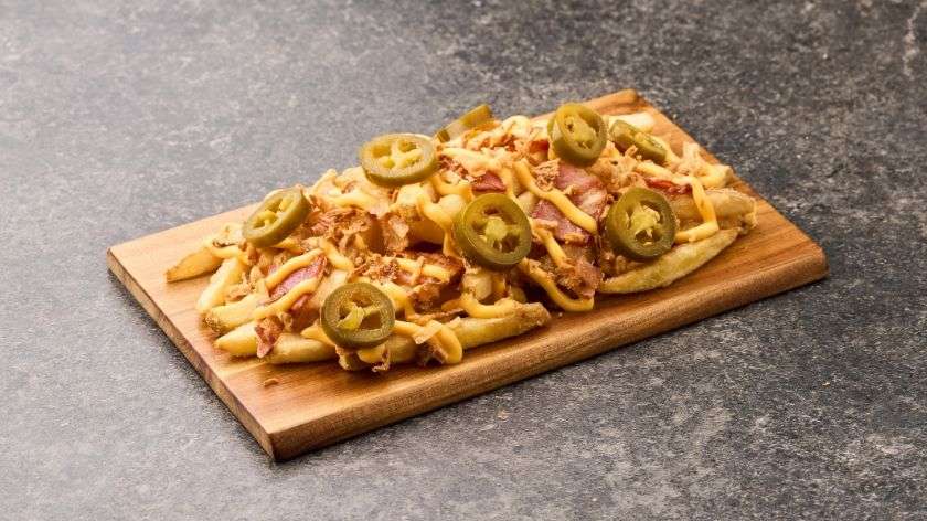 French Fries with Bacon, Jalapenos and Cheddar Sauce