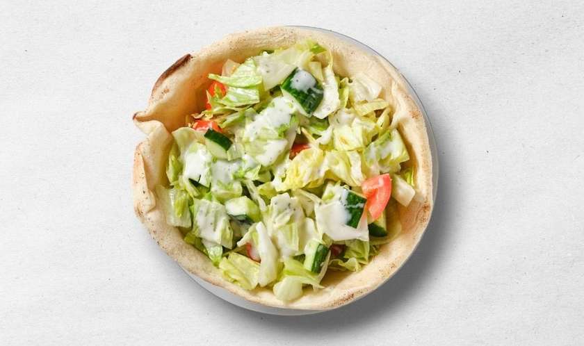 Vegetable salad in a pizza hat
