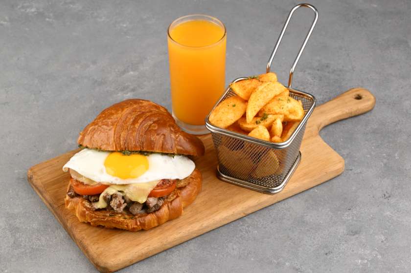 Croissant Steak Sandwich with Accompaniment