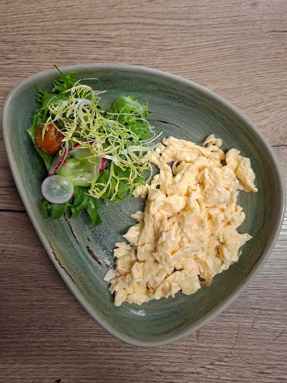Scrambled eggs with salad