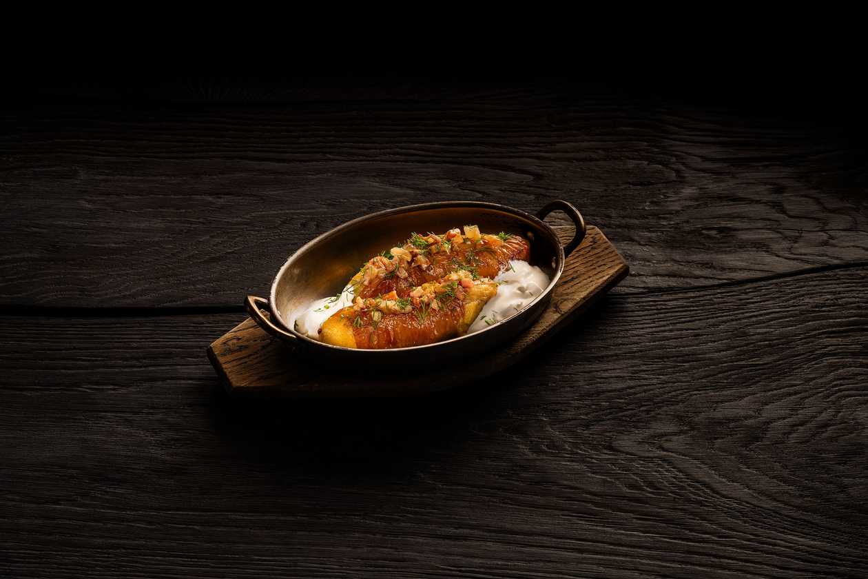 "Tavern" Kishka with crackling and sour cream sauce