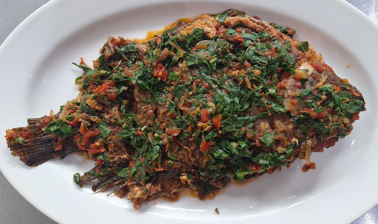 Fish Tilapia whole wet fried in Spinach/Sukuma (kales)