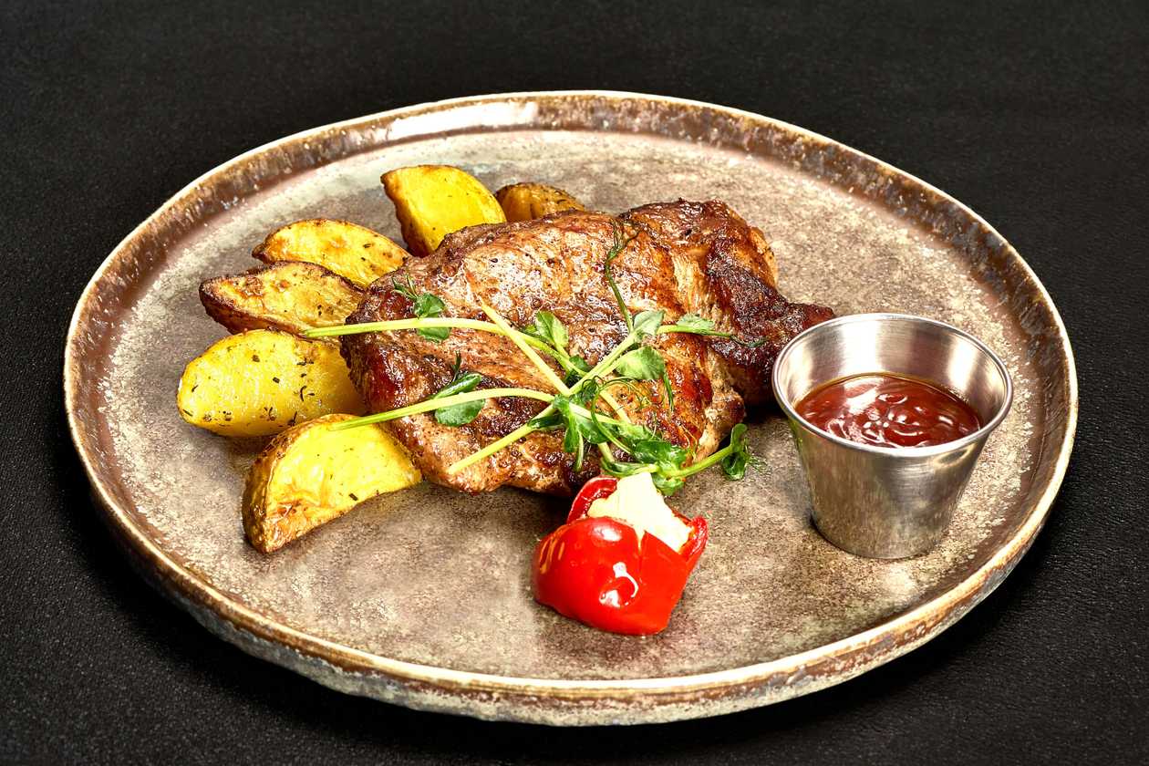 Pork Steak with Potatoes and Barbecue Sauce