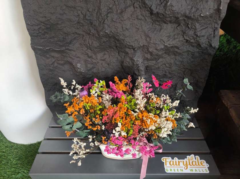 Dry Flower Arrangement into a wooden mini pot