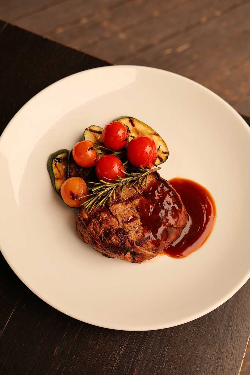 Beef tenderloin steak served with demi-glace sauce
