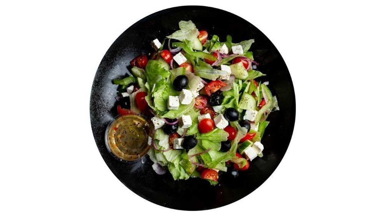 Greek salad  with salad dressing
