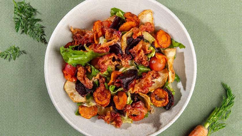 Fried root vegetable salad with crispy bacon