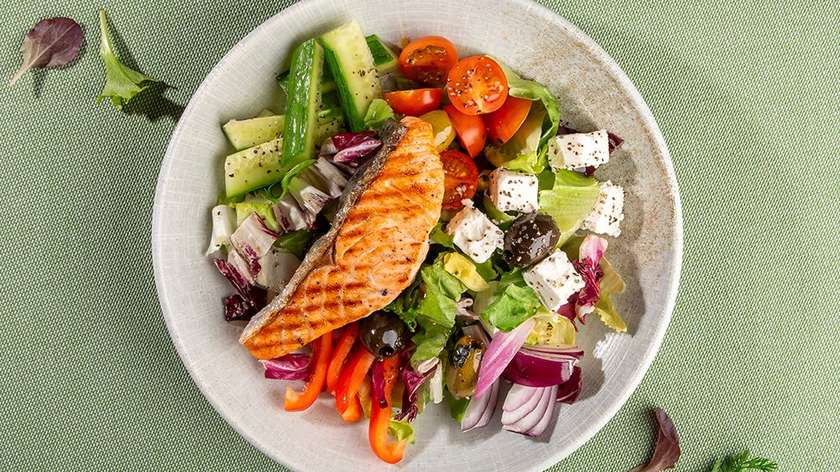 Feta cheese salad with fried salmon