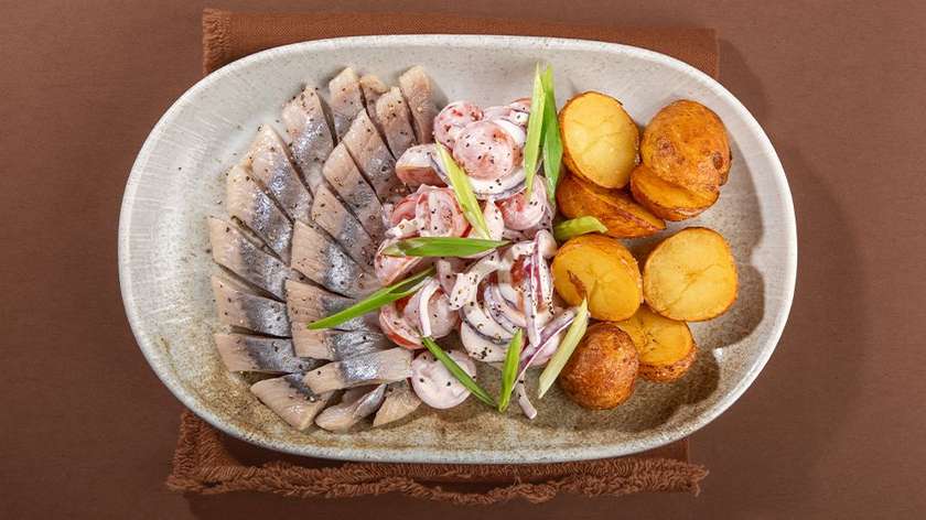 Herring with tomato salad