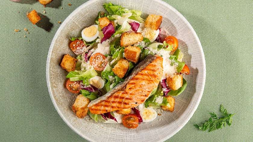 Lithuanian Caesar salad with fried salmon