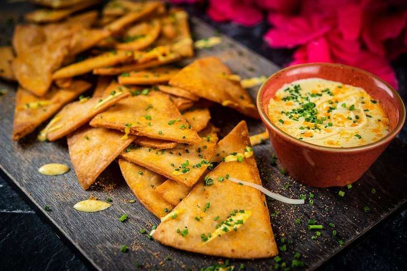 Taqueria nachos with cheese sauce