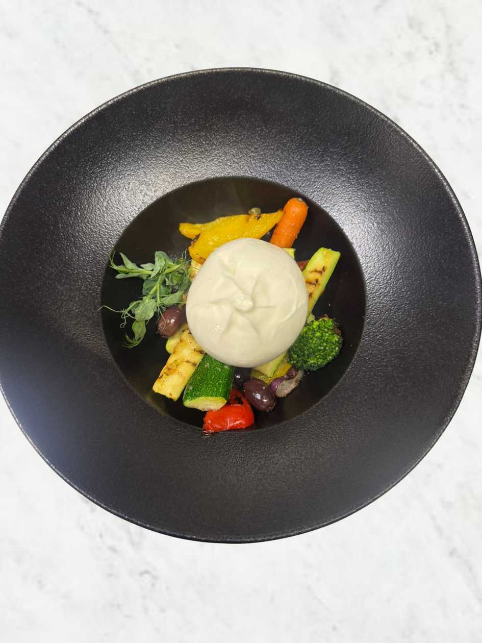 Buffalo Burrata with grilled Mediterranean vegetables, olives, capers & basil pesto