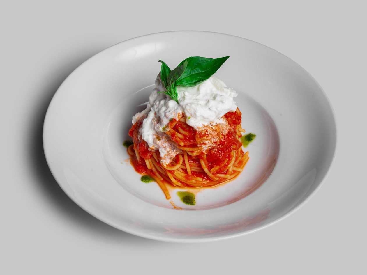 Spaghetti with fresh tomato, burrata, and basil