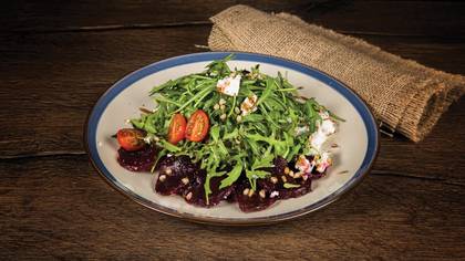 Beetroot carpaccio with goat cheese and arugula