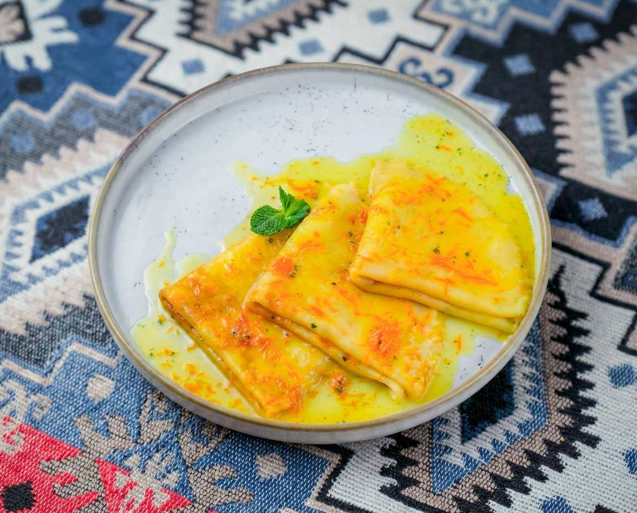 Plant-Based Crepes with Orange Sauce