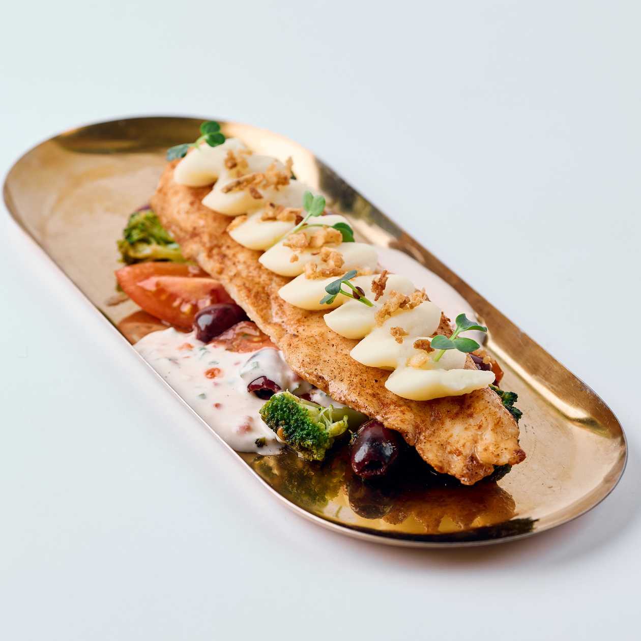 White fish fillet in creamy caviar sauce