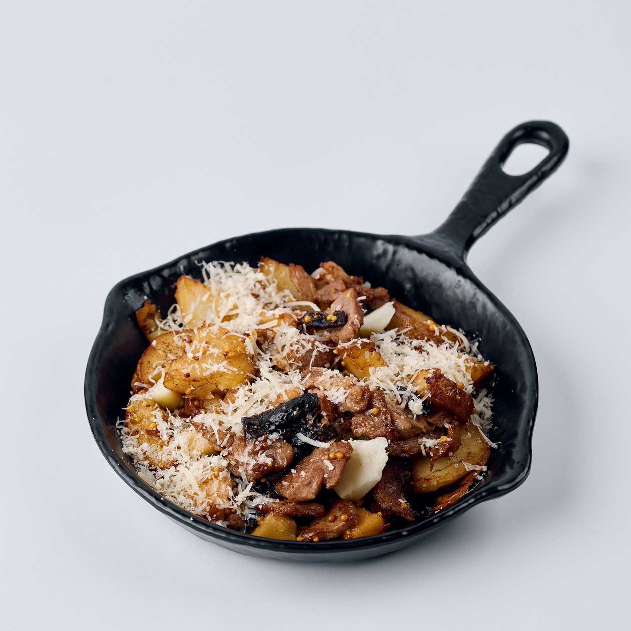 Baked Potatoes with Pork, Prunes, and Apple