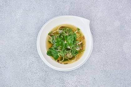 Wok vegetable broth with stir-fried turkey breast