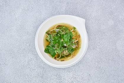 Wok vegetable broth with stir-fried salmon