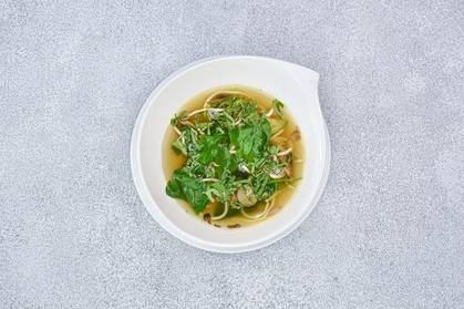 Wok vegetable broth with stir-fried chicken breast
