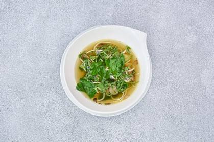 Wok vegetable broth with stir-fried beef tenderloin