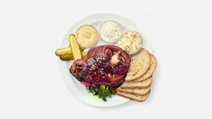Deboned marinated pork knuckle roasted on black Kozel, mustard, fresh horseradish, ram's horns, bread