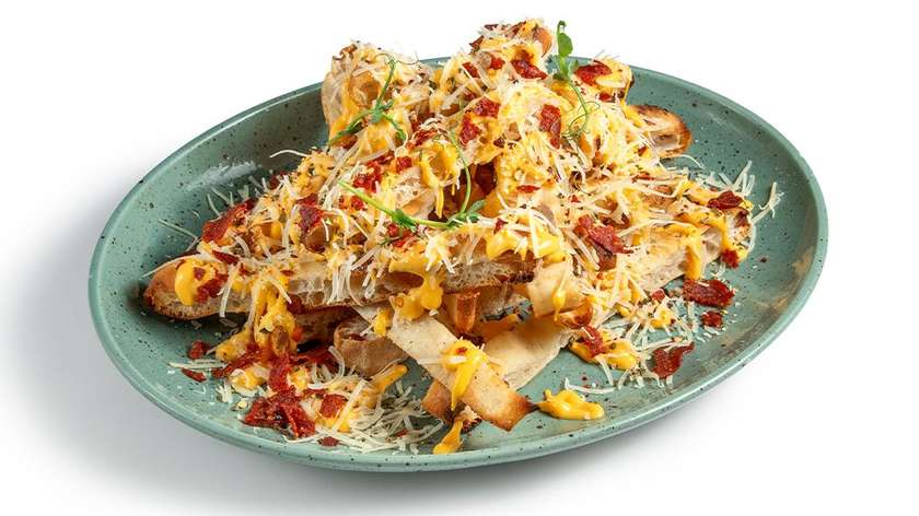 Pinsa strips with cheddar sause,cheese,and crispy pepperoni