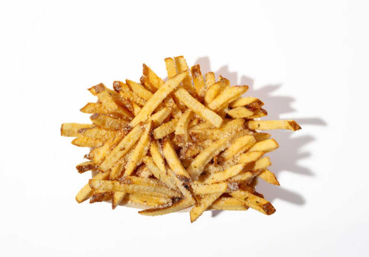 Fries with garlic, greens and parmesan