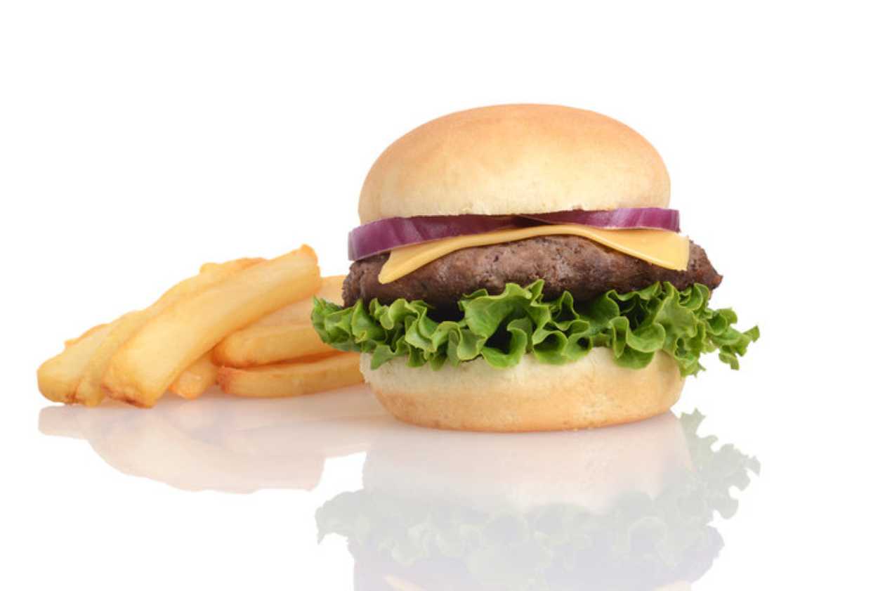 Beef cheeseburger with fries with garlic and greens
